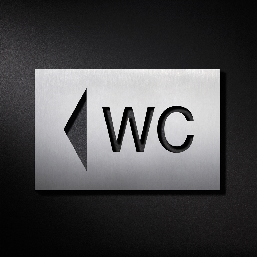 Mostra il prodotto Cartello WC, freccia rivolta a sinistra del produttore PHOS Design