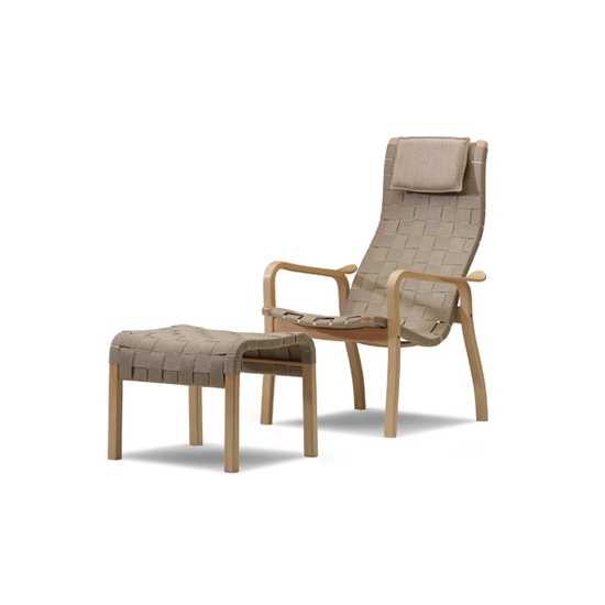 Display product Primo easy chair with footstool from manufacturer Swedese