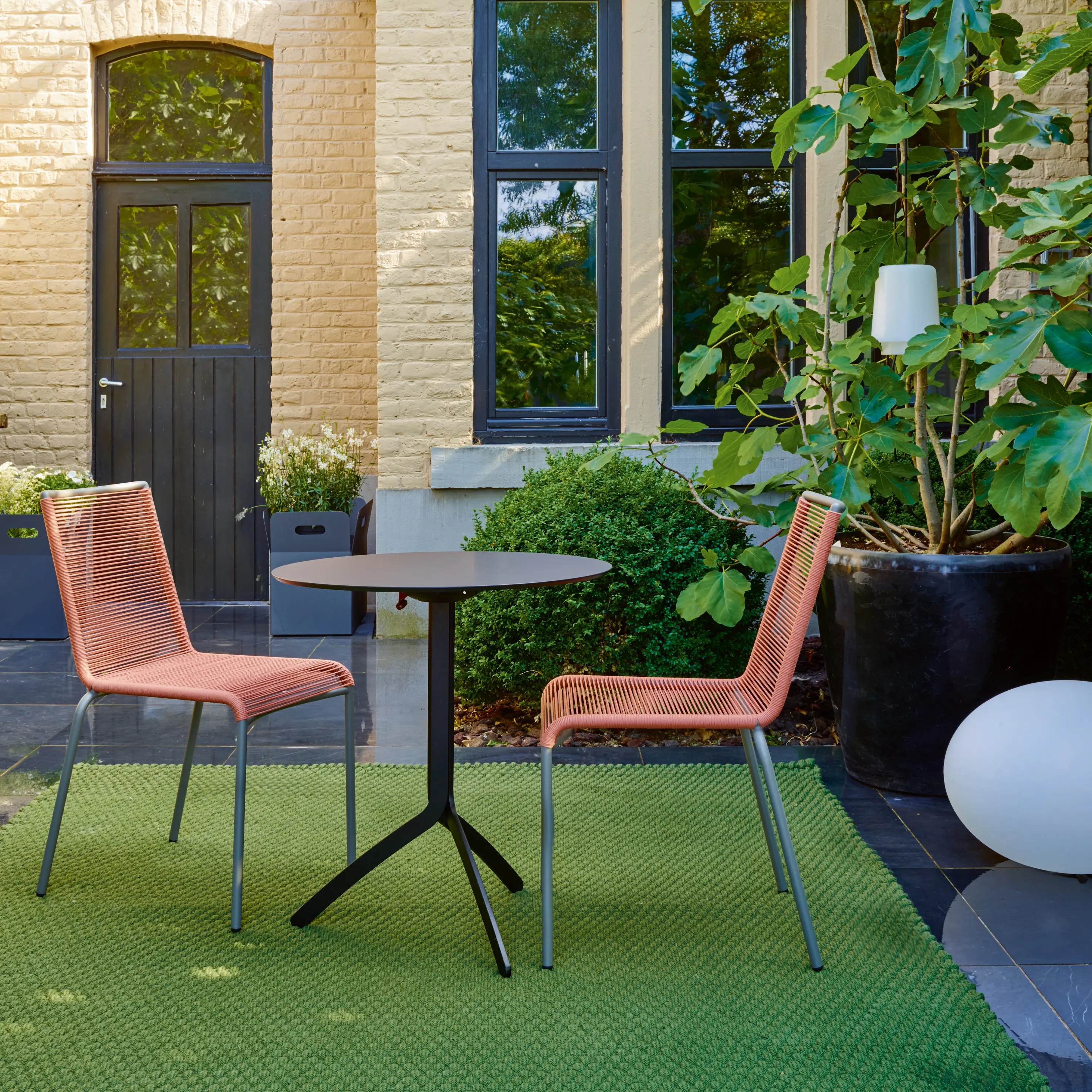 Ligne Roset - Noomi | Dining Table With Pivoting Top Top In Black Fenix Laminate Black Lacquered Base