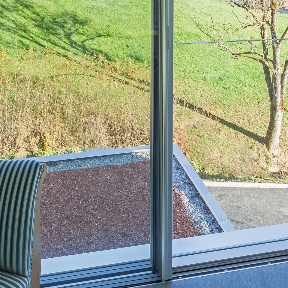 Display product Frameless sliding windows with all-glass safety barrier from manufacturer swissFineLine