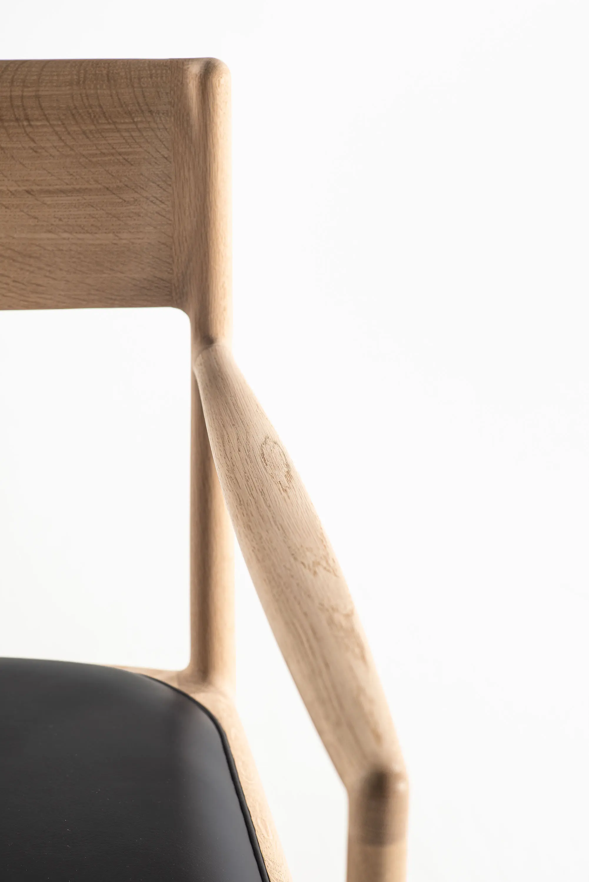 Time & Style - A chair on the vertical axis arm