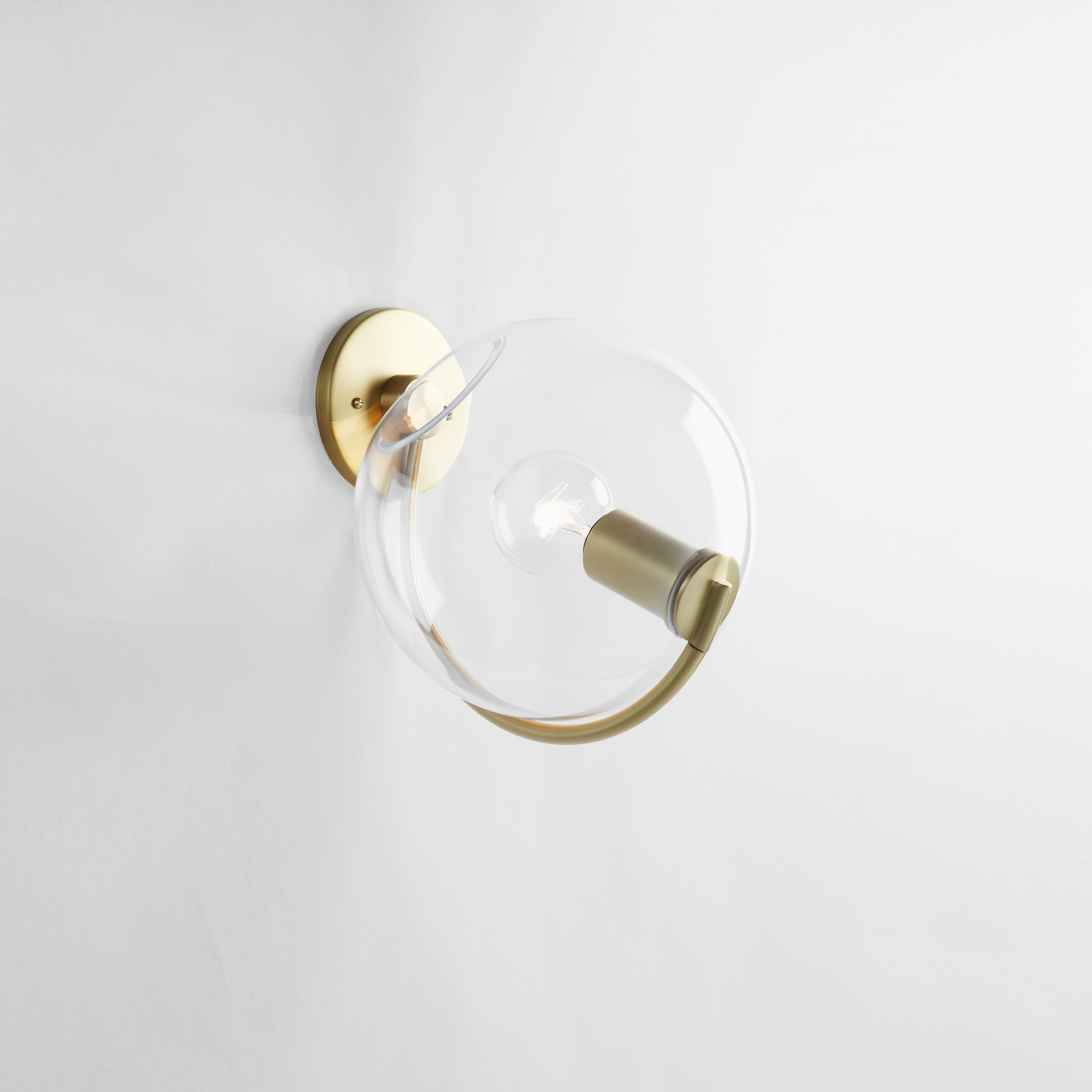 Display product Fiddlehead Sconce (Brass/Clear) from manufacturer Roll & Hill