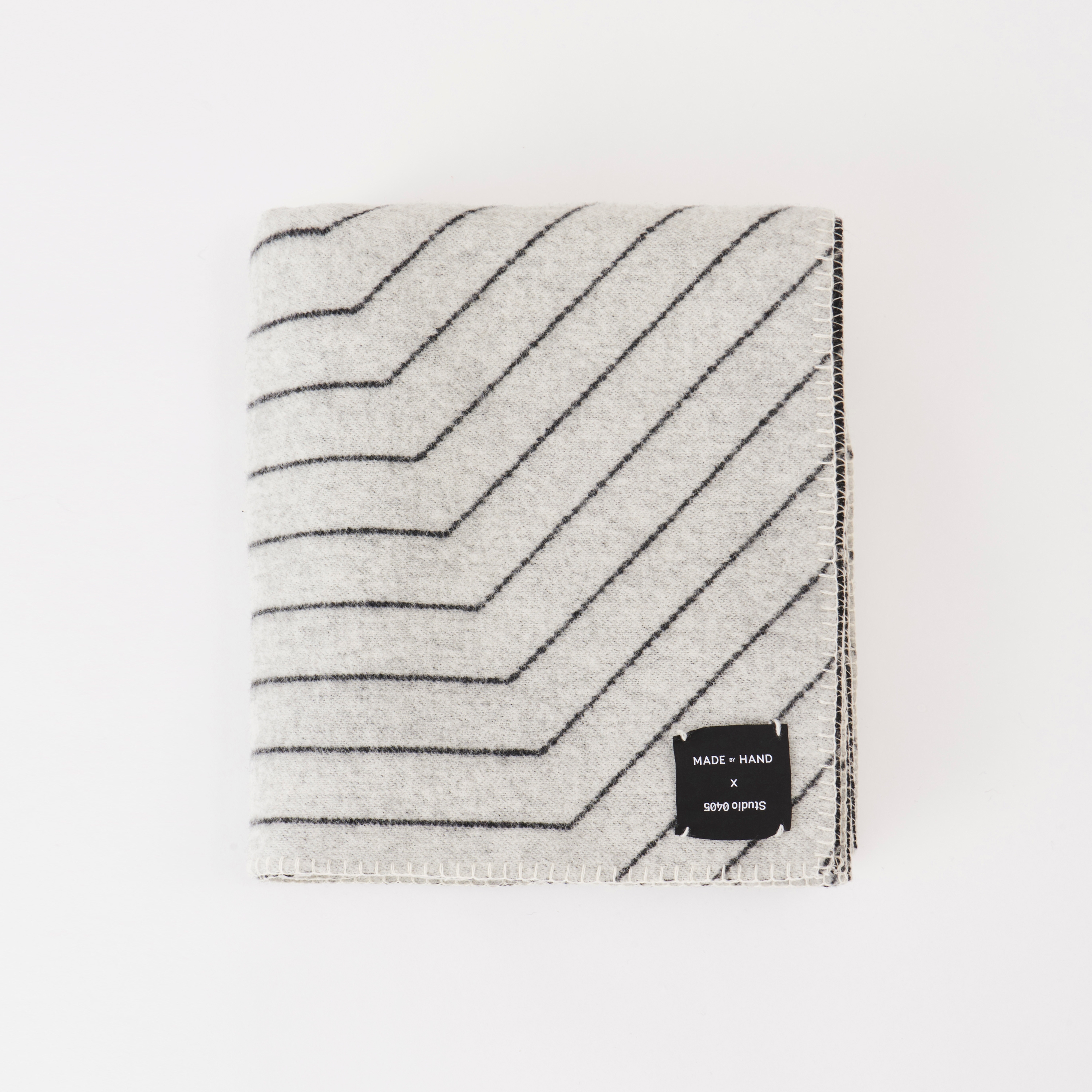 Display product Pinstripe Throw Black from manufacturer Made by Hand