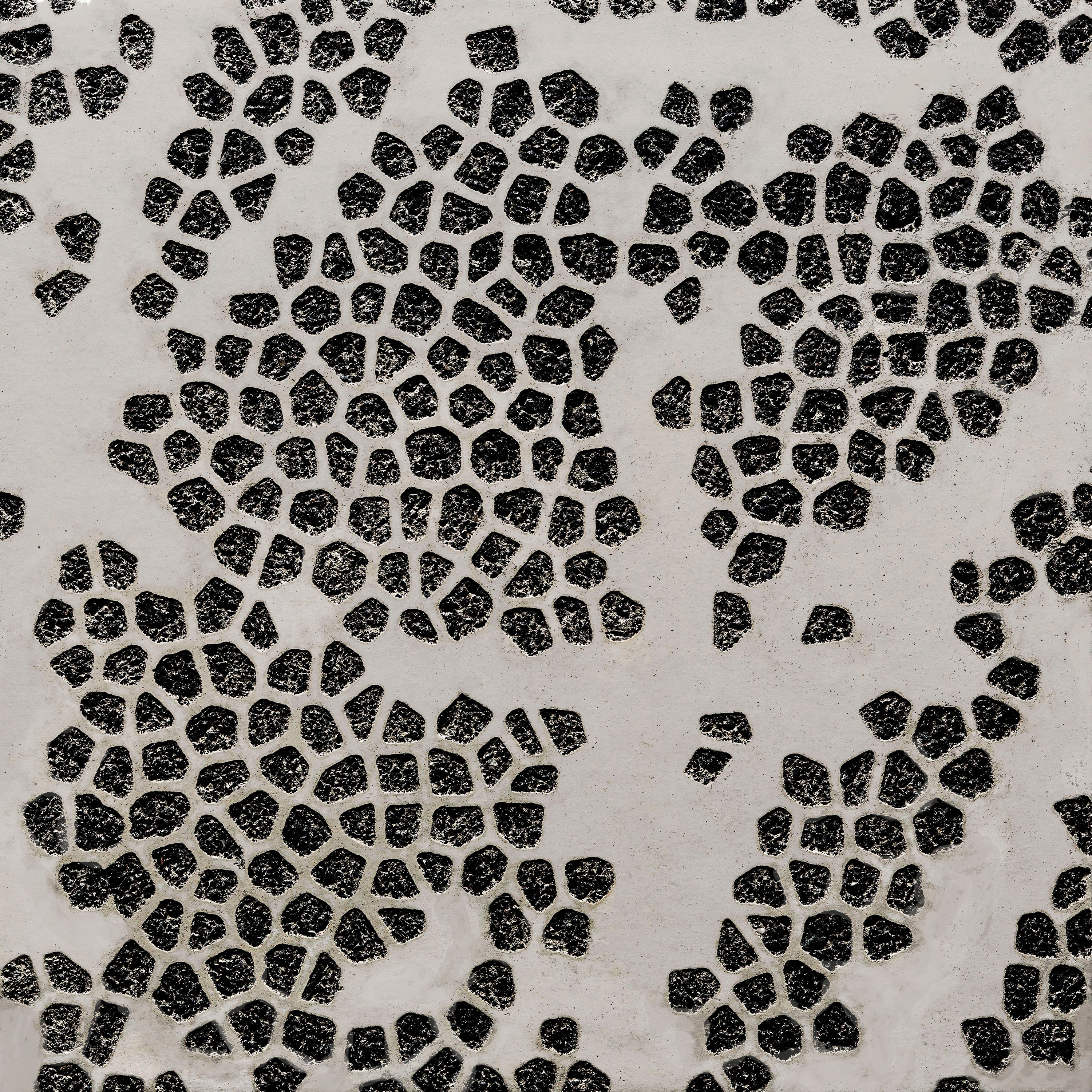 Display product GCFlow Mosaic Ellipse white cement - black aggregate from manufacturer Graphic Concrete