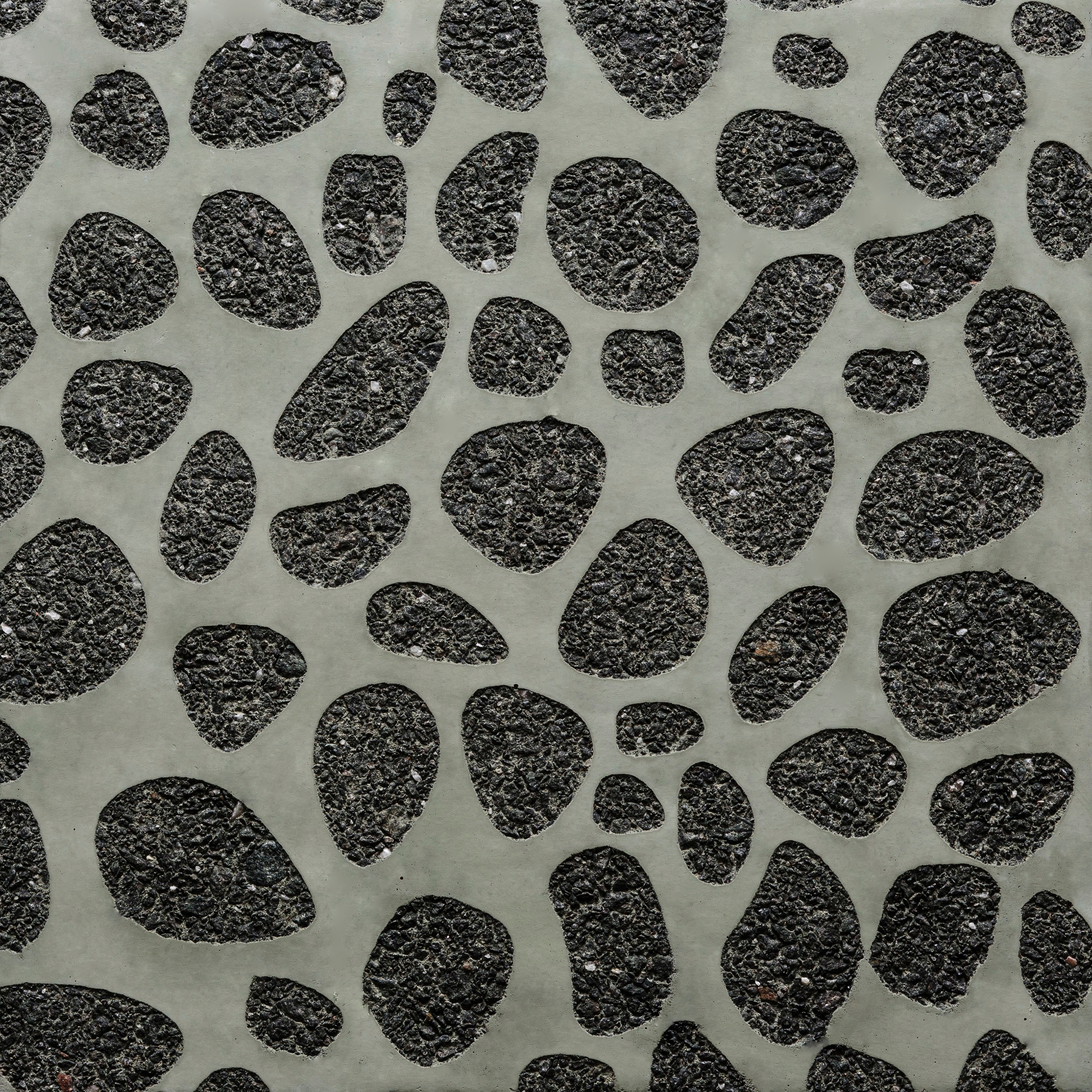 Afficher le produit GCNature Pebbles25 nega green cement - black aggregate du fabricant Graphic Concrete