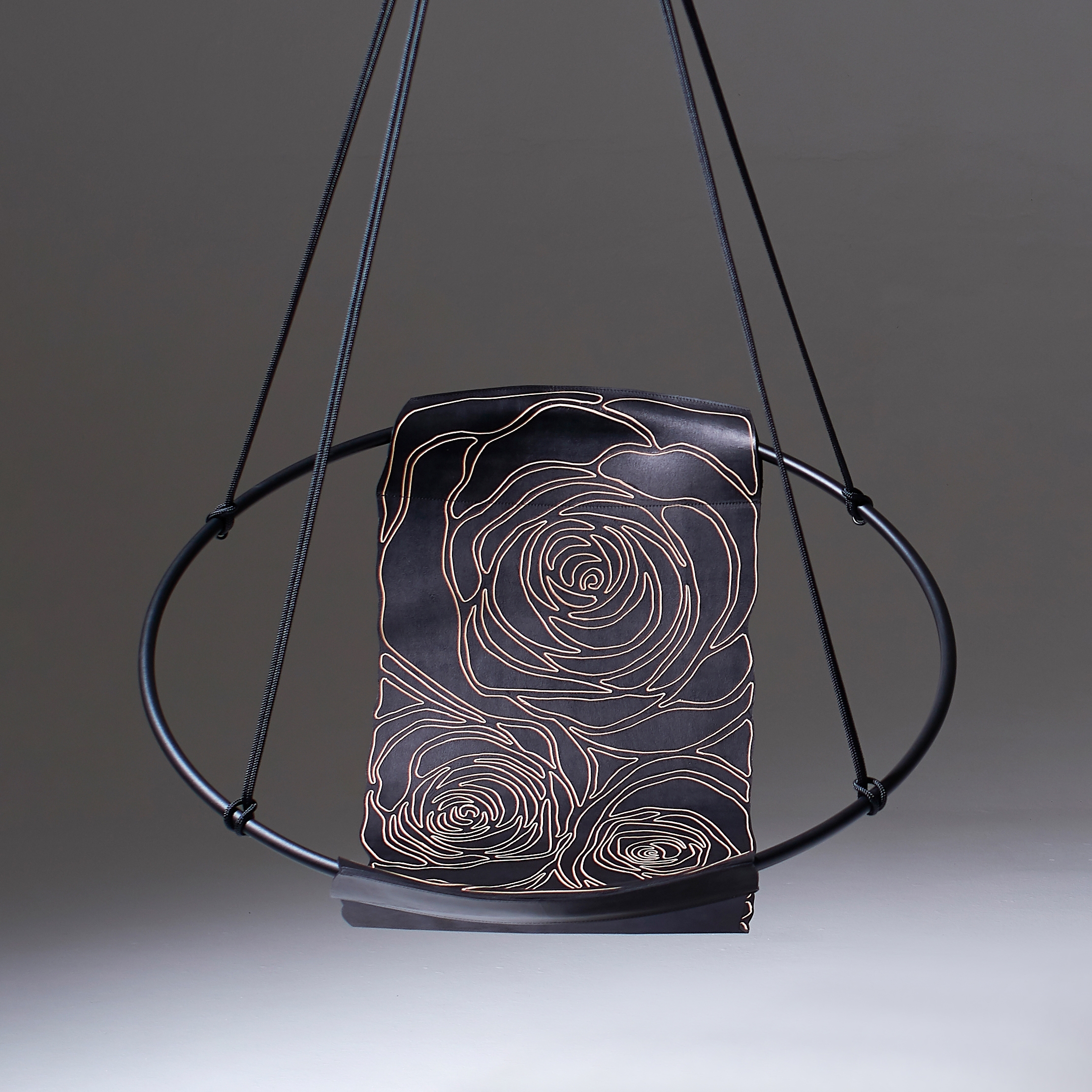 Display product Sling Hanging Chair - Rose Carved Leather from manufacturer Studio Stirling