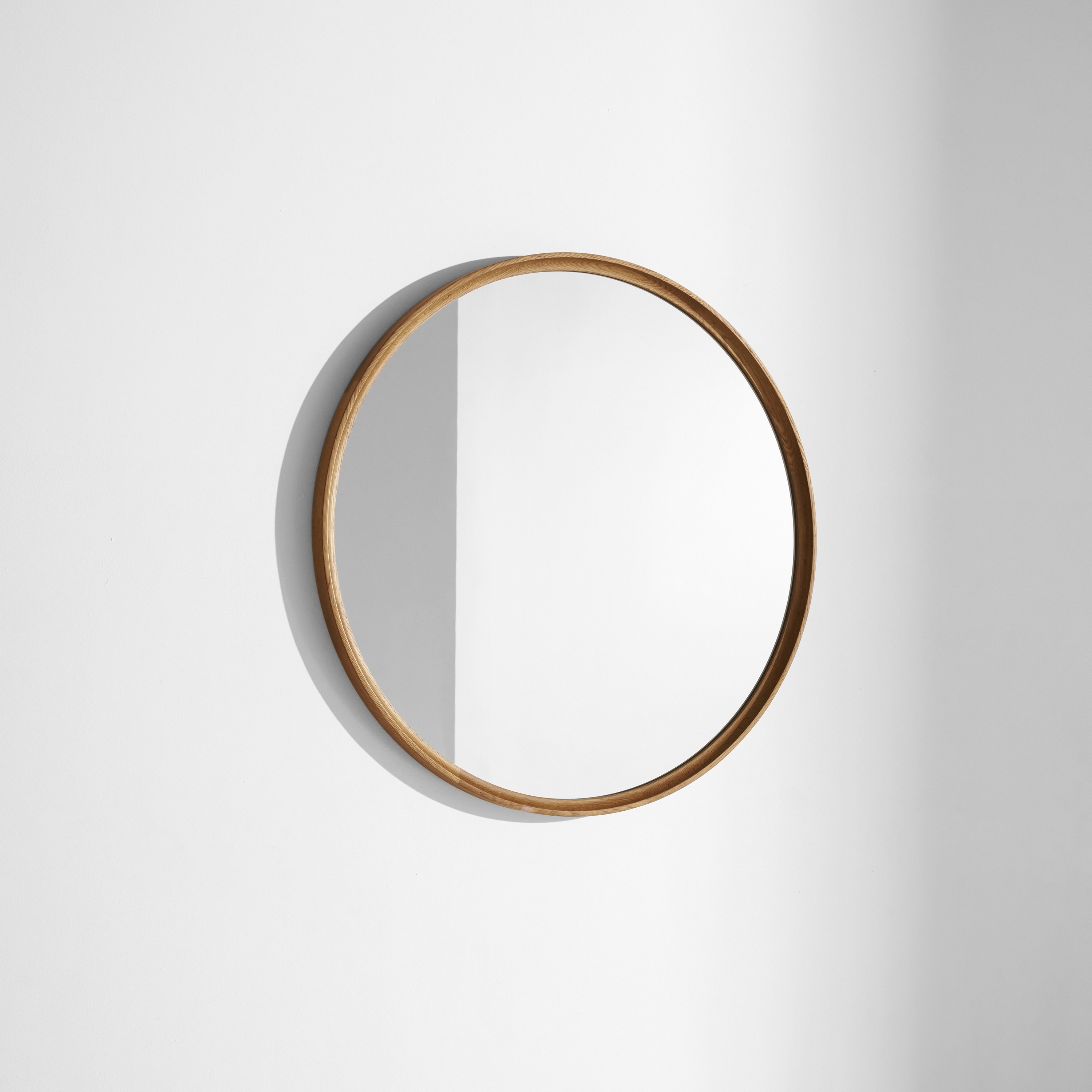 Display product Mirror | Round Mirror with hard fumed solid oak frame from manufacturer District Eight