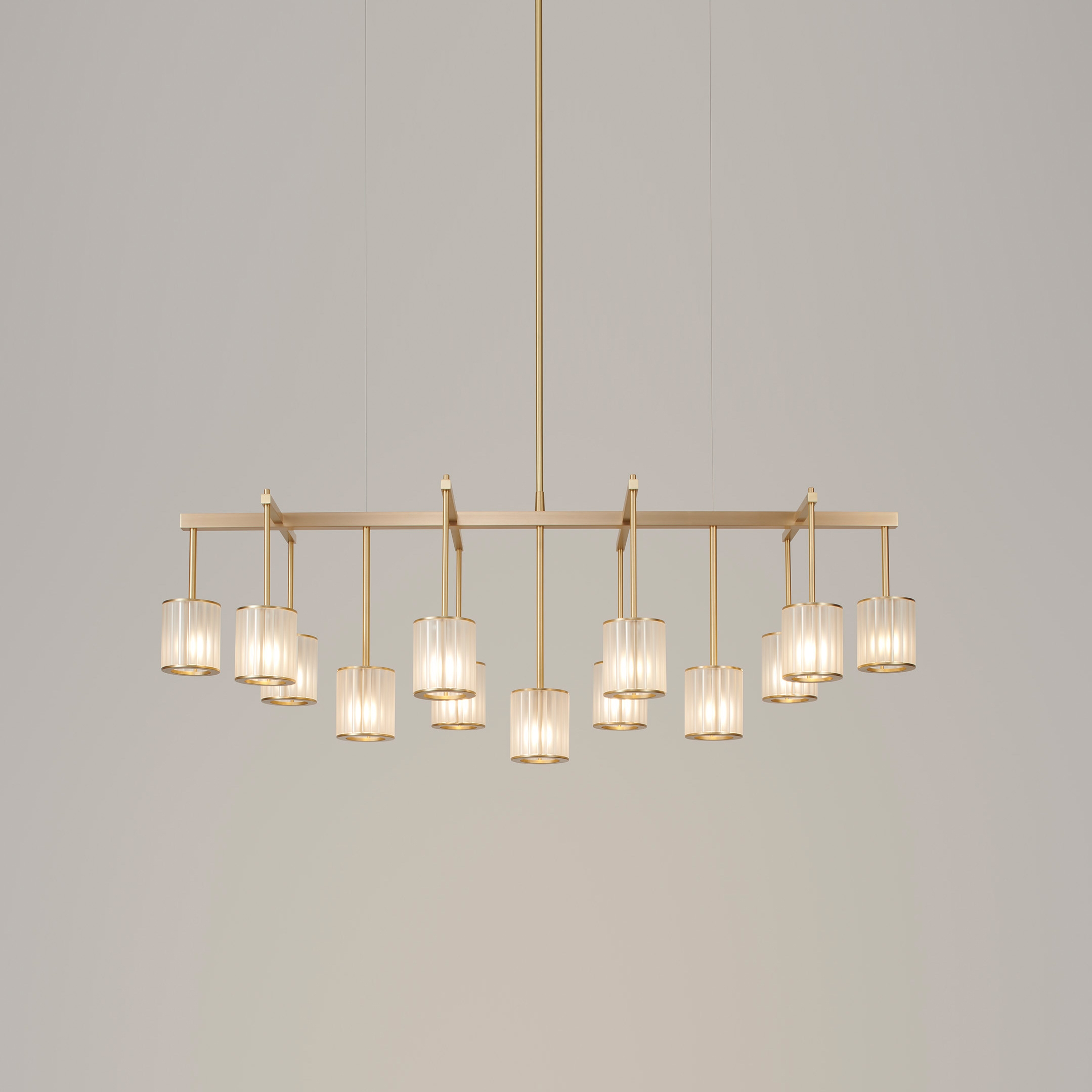 Display product Flute Beam Chandelier 13-arm brushed brass frosted glass from manufacturer Tom Kirk Lighting