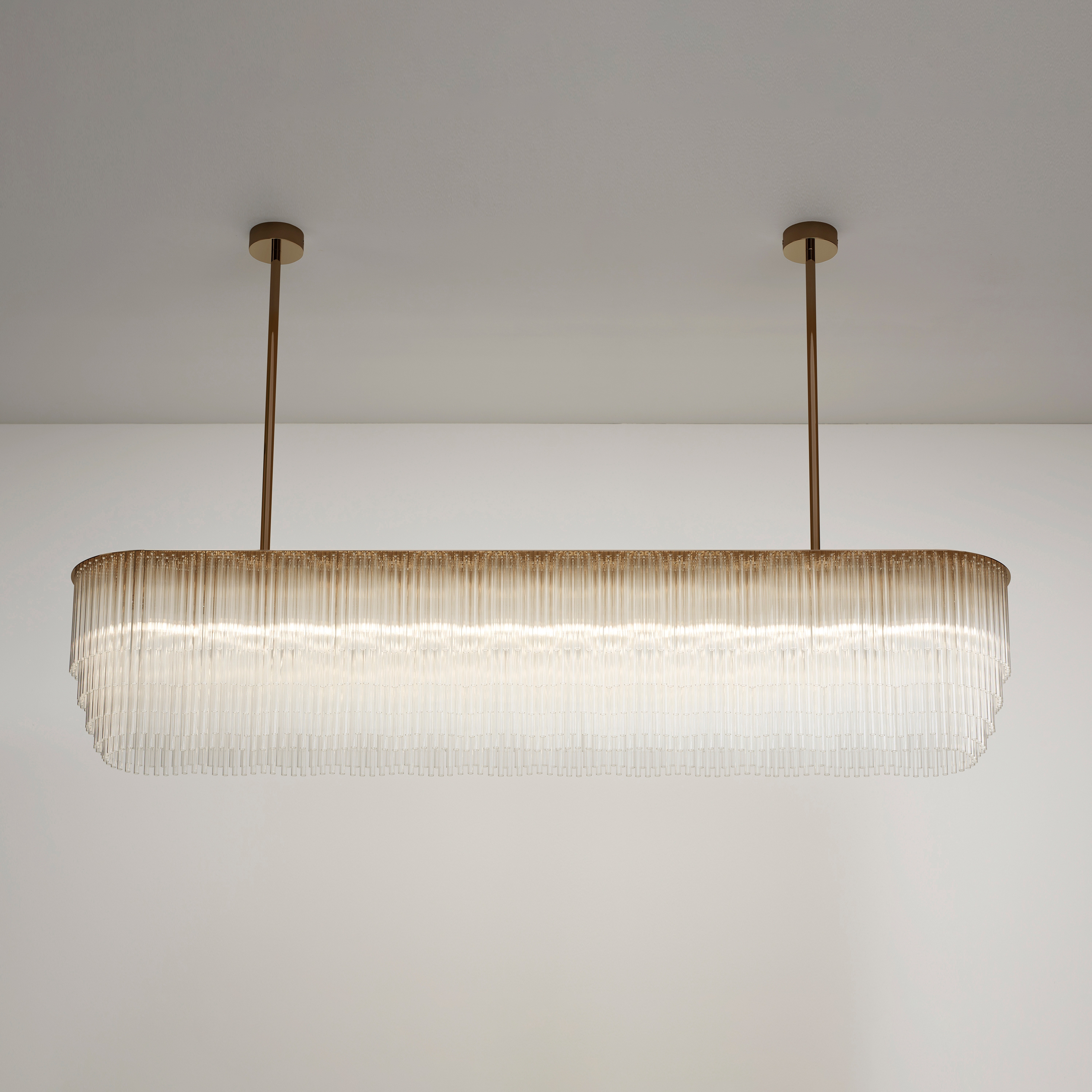 Display product Linear Chandelier brass based bronze from manufacturer Tom Kirk Lighting