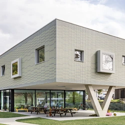 Read about project Scalloped Kindergarten | Castel San Pietro, Schweiz