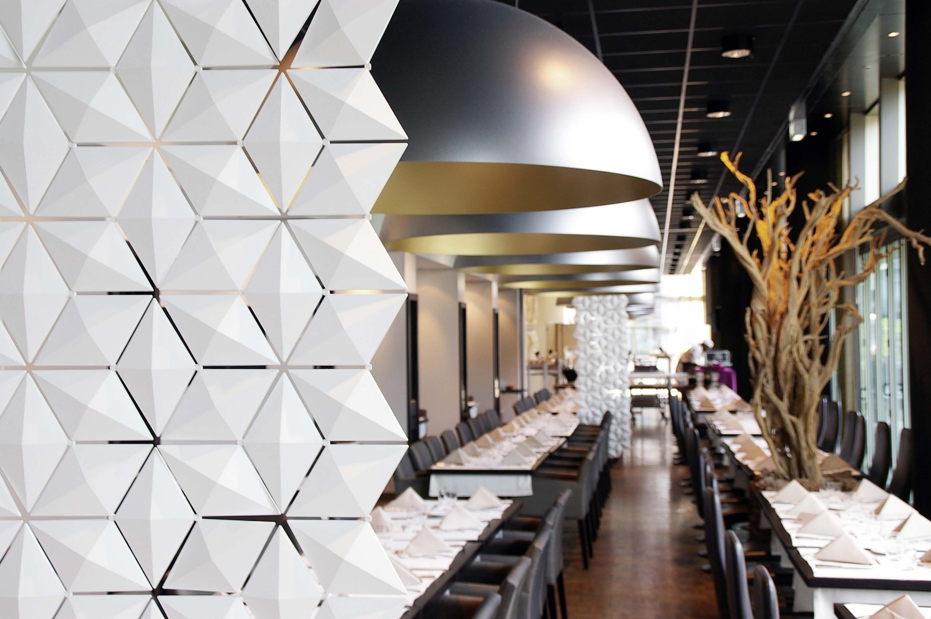 Read about project A sculptural room divider transforming the Artemis dining experience