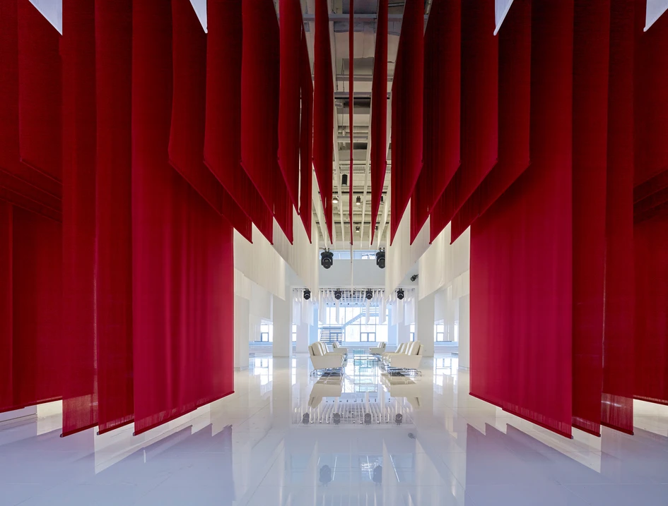 Beijing’s Zhengtong BMW Museum, designed by Crossboundaries, sees suspended textile planes create architectural volume via a compelling layering.  Photos: YANG Chao Ying