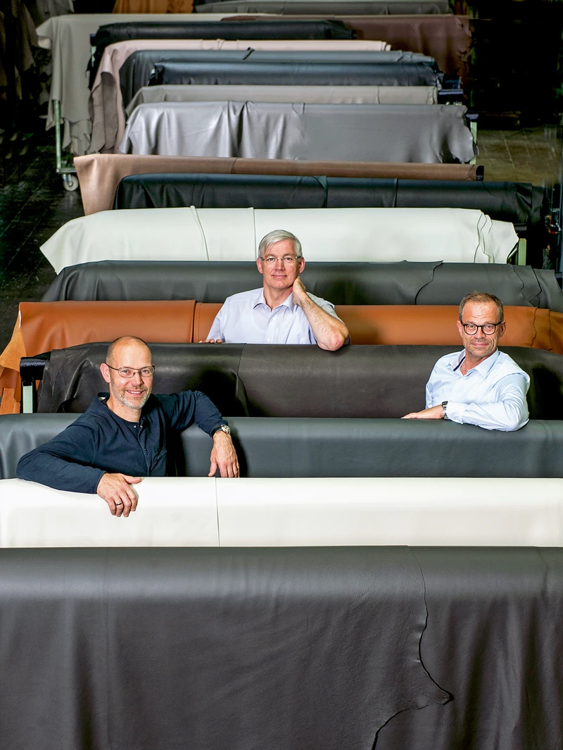 Exceptionally snug: the Cordia lounge chair gives relaxation a whole new meaning (top); Leo Lübke, managing partner, Hermann-Josef Pöhls, technical director, Berthold Strüve, head of marketing (above from left)