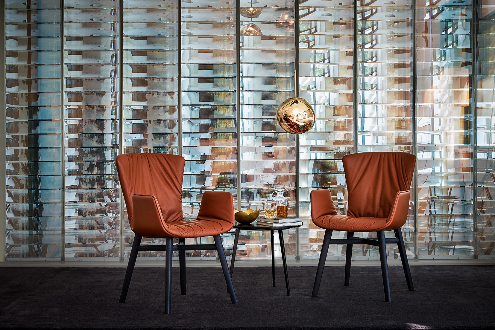 Victor: an archaic-looking table sculpture with a solid wood top and a steel frame made of I-girder (top); Dexter: fine lines and soft leather with a bog oak frame (above)