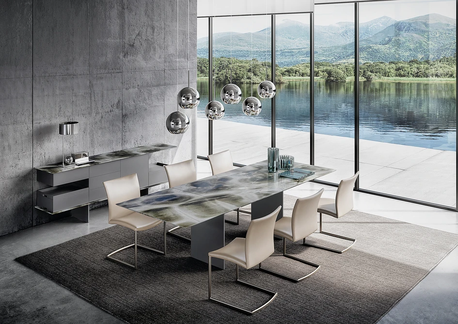 Blow: the exquisite coffee tables combine natural stone and glass in perfect harmony (top); Atlas: the extendable table is the epitome of movement and symmetry – stone: turtle (above)  