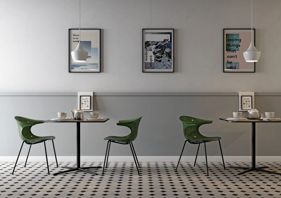 The Loop table, seen here alongside glossy green vintage style Loop chairs, has a striking low base profile. The table is the epitome of balance and poise, reminiscent of a bird’s foot; graceful yet secure, elegantly pincering terra firma