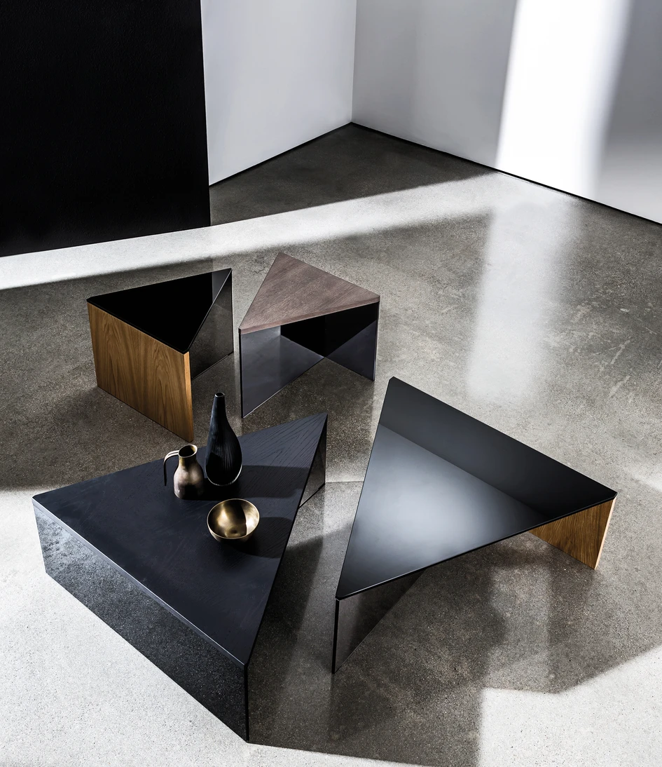 By combining different materials for the surface and frame, the Regolo tables and consoles designed by Lievore Altherr Molina can be adapted to a wide variety of interior contexts. Top: Regolo dining table; Above: Regolo Triangular coffee table