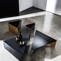 By combining different materials for the surface and frame, the Regolo tables and consoles designed by Lievore Altherr Molina can be adapted to a wide variety of interior contexts. Top: Regolo dining table; Above: Regolo Triangular coffee table
