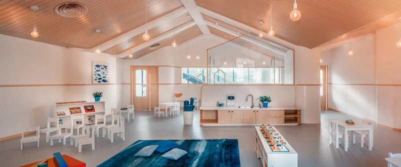 ArkA Design has introduced a number of child-friendly features in their Beijing Peninsula Kindergarten, including rounded corners, glass balustrades and large windows that allow teachers to observe children at play. Photography: Chiara Ye
