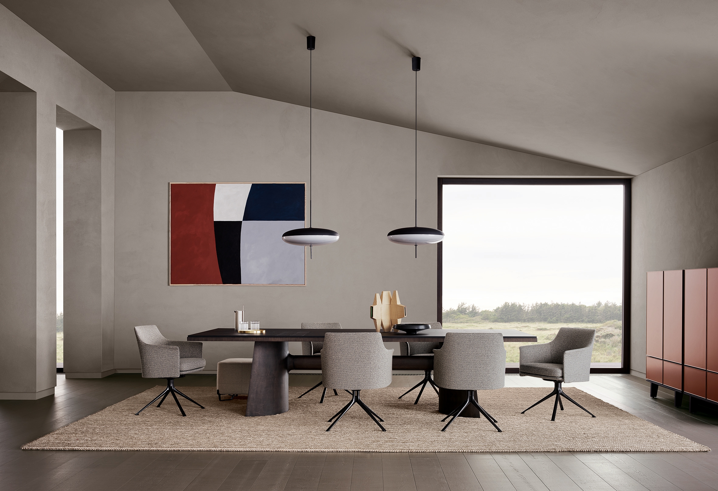 Typically elegant yet understated pieces by Massaud, including his Stanford chairs and monumental elm and bronze Kensington table