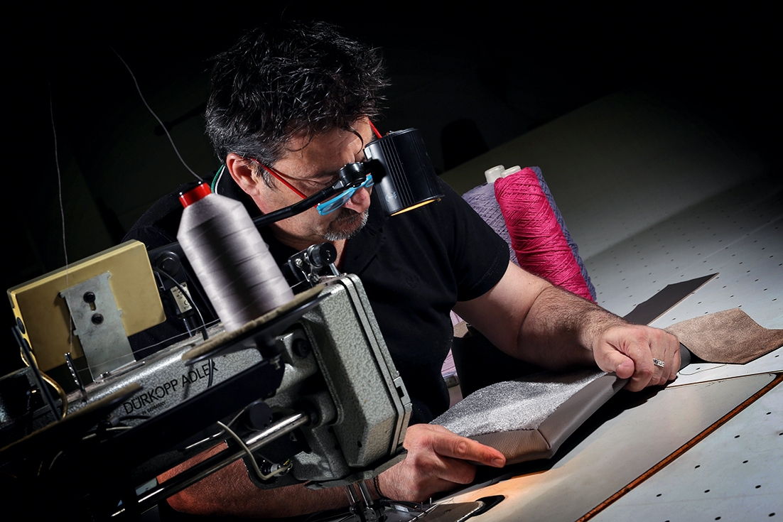 Flexible: In Krefeld, production is geared to customers’ individual specifications (top); Labour of love: the carpets are hand-finished (above) 