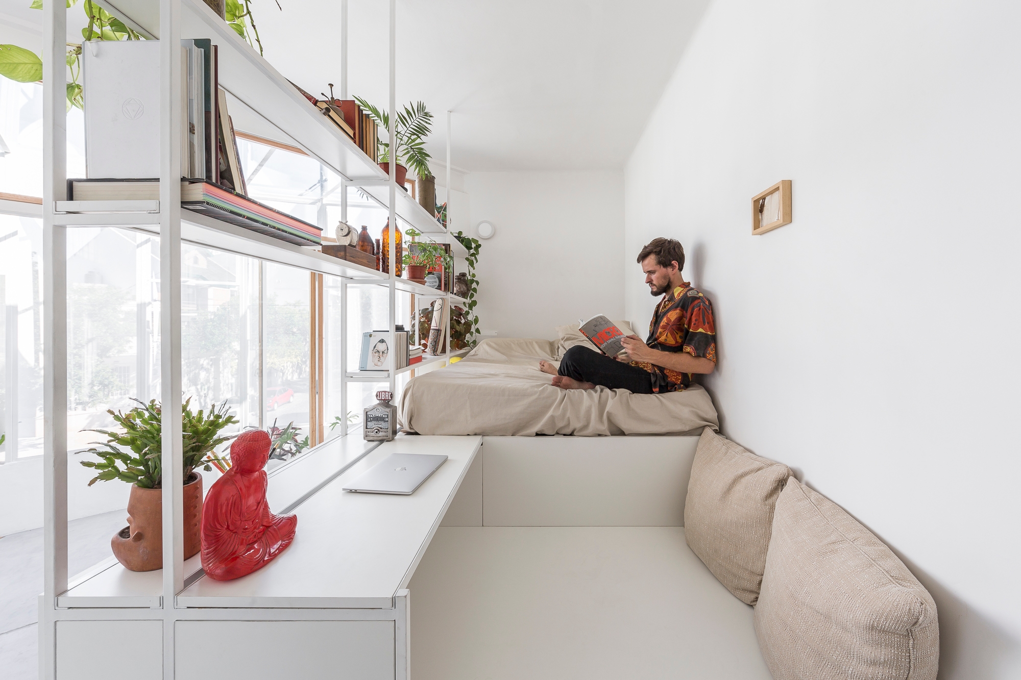 Balancing the need for views and semi-outdoor spaces with privacy is essential to micro living in urban areas, as demonstrated by IR aquitectura's El Camarín, a compact corner studio. Photographer: Fernando Schapochnik