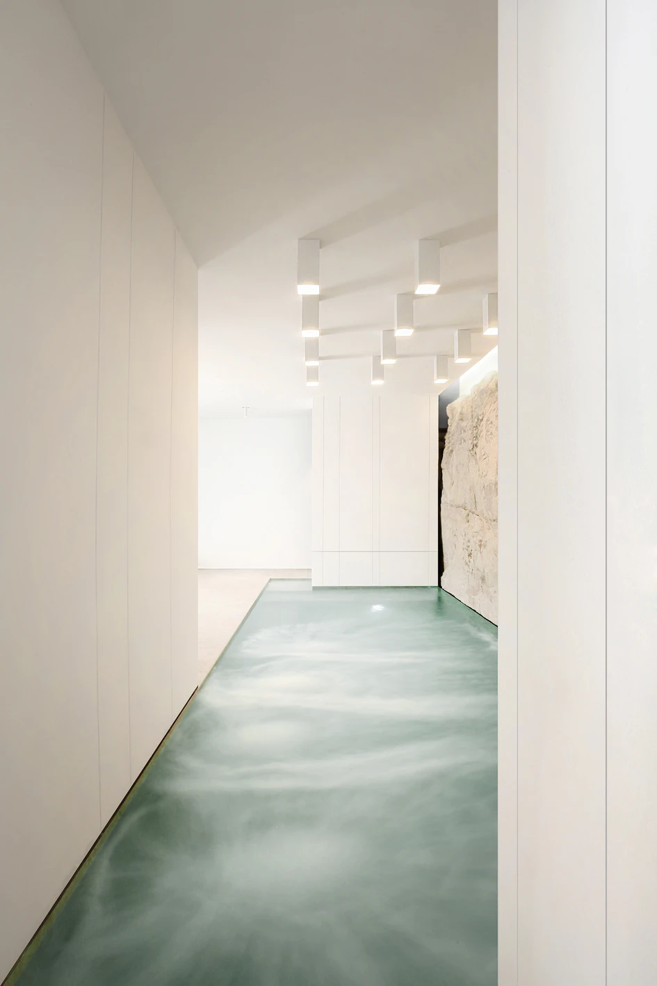 Tomas Ghisellini Architects’ White Digger spa in southern Italy features a swimming pool carved into mountain rock. Photo: Tomas Ghisellini