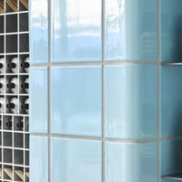 The image of poolside relaxation in the Aesop Century City store in Santa Monica is further reinforced by the inclusion of a large, potted palm tree and a bright yellow reclining lawn chair