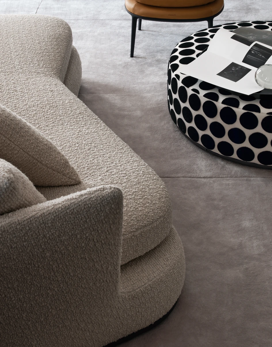Citterio designed the Apollo sofa to envelop the body in a deep, curvaceous seat with a high backrest and plenty of plump cushions