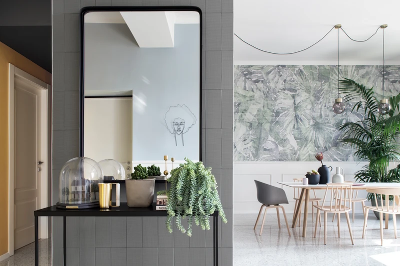 Inspired by explorers of the Amazon and designed by illustrator Marco Fontana, the wallpaper provides colour and detail that help define the spaces within the kitchen area. Photos by Riccardo Gasperoni
