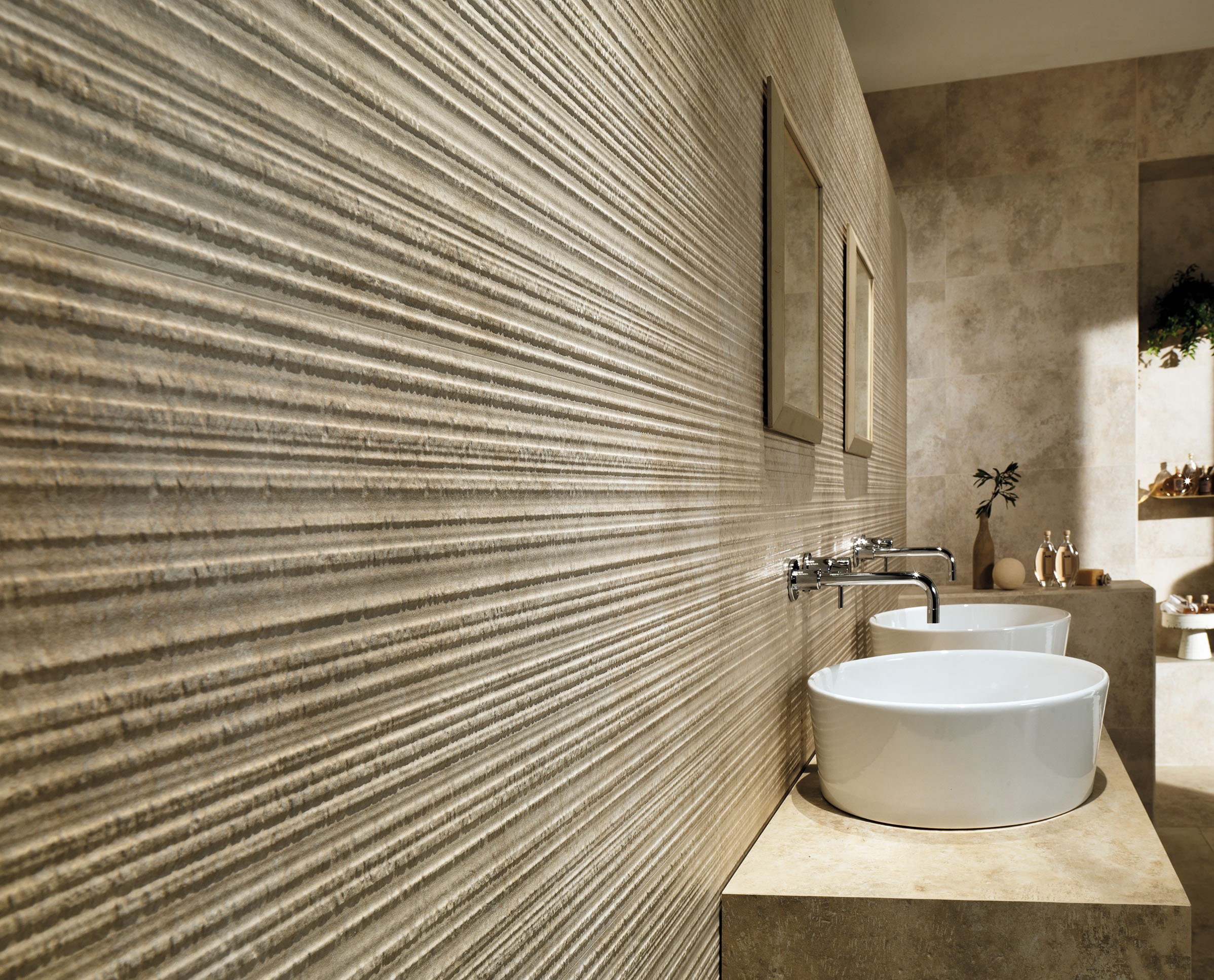 Aix’s mottled surfaces are appealingly weathered, while the collection can be personalised with its ridged wall tiles from its decorative range 