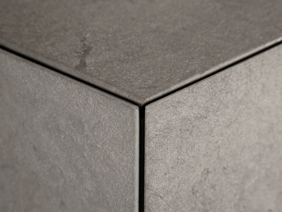 The monolithic Monolite kitchen recalls stone slabs found in nature yet its subtly striated limestone, smooth lacquer surfaces and doors with discreet push-pull openings lend it a metropolitan sophistication