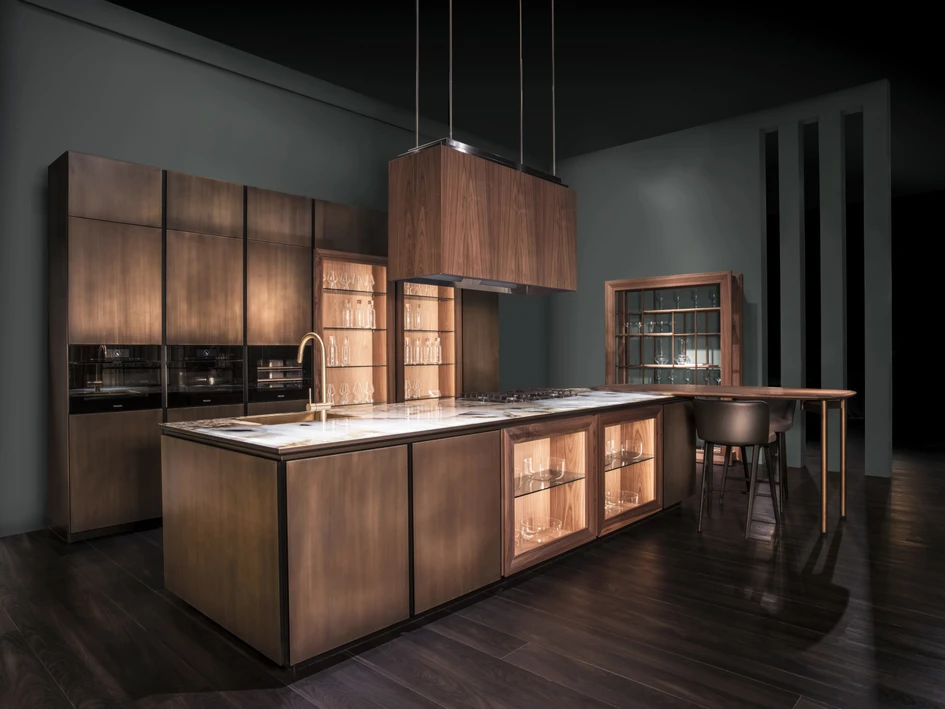 Labirinto, another design, which incorporates Canaletto walnut, brass and backlit glass, creates a warm, immersive atmosphere inspired by Italian gardens 