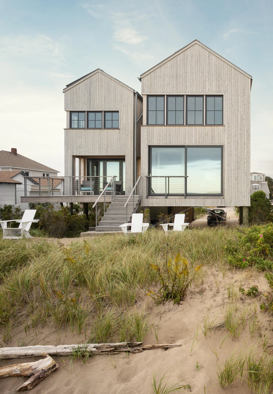 Caleb Johnson Studio’s ‘In The Dunes’ project in Maine consists of two, timber-clad conjoined volumes which serve to break up its visual bulk. Photo: Trent Bell Photography