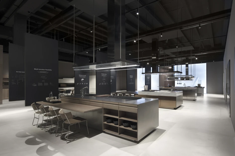 The designs of creative director Antonio Citterio are sleek and architectural. Top: Lignum et Lapis island, door with Italia handle in FenixNTM®; above: internal drawers with sides in stainless steel and NTF teak front, fitted with Box Globe accessories