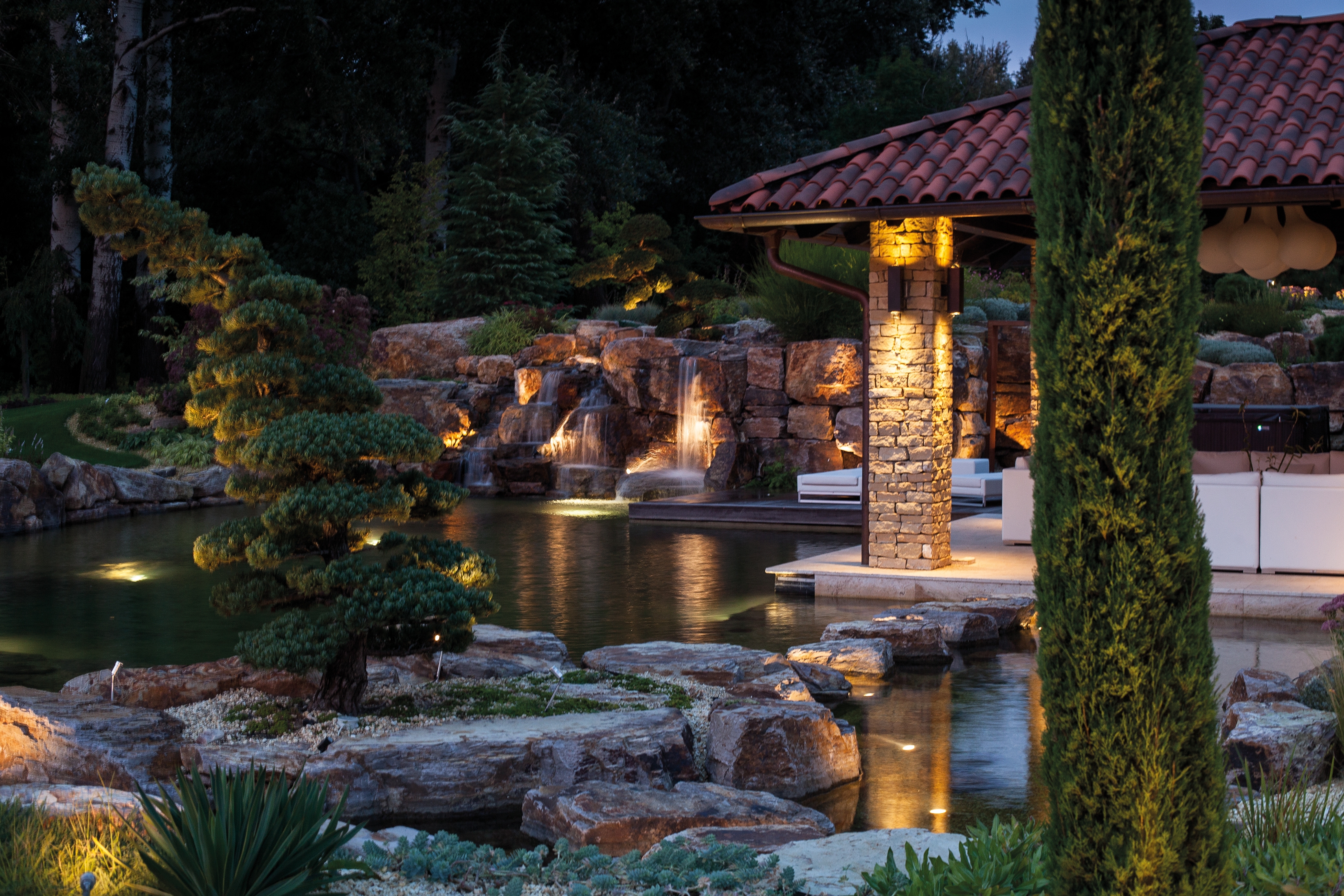 With clever lighting, you can enjoy pools and swimming ponds in the evening, too