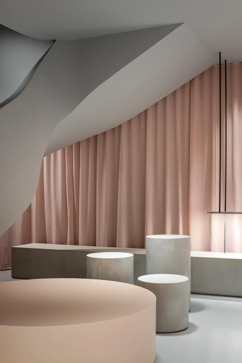 The textile curtain in Francesc Rifé-designed ASH Mallorca creates a sensual nude backdrop for the wares, but also hides the door to the shop's storeroom. Photos: David Zarzoso