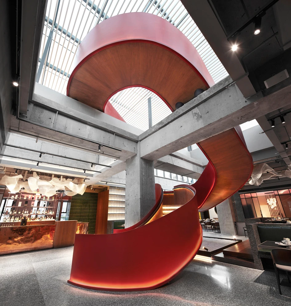 The so-called ‘red ribbon' at the centre of Funun Lab's JE Beijing Restaurant adds to the space's hedonistic, theatrical flair. Photo: Ruijing Photo