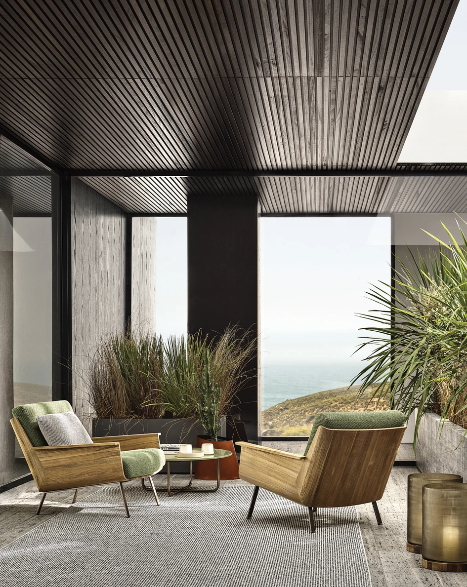 Marcio Kogan’s outdoor Daiki armchairs are almost identical to their indoor counterparts, save for their wooden frames, which are made of hard-wearing, weather-resistant teak