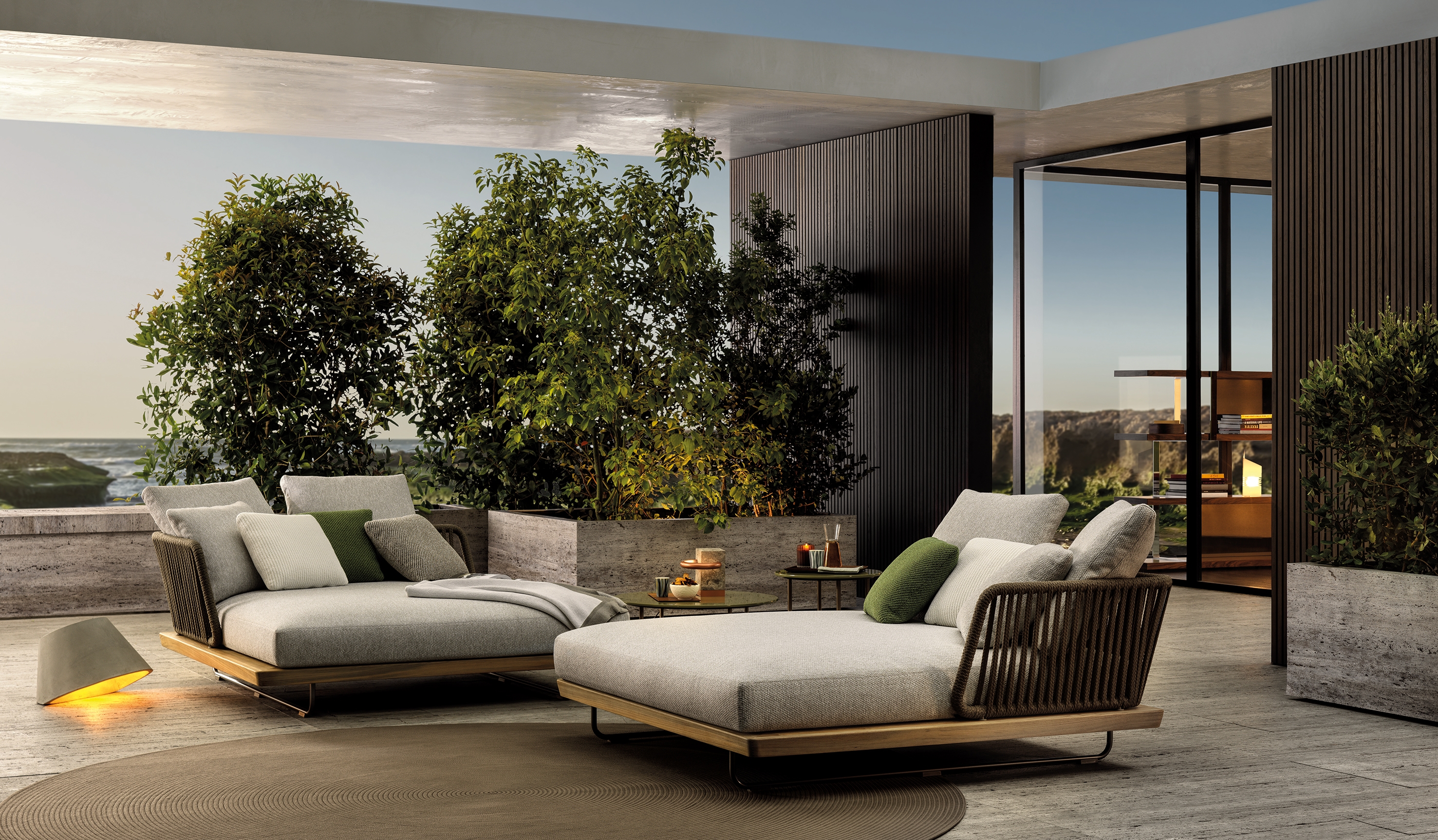 Rodolfo Dordoni's Sunray collection includes seating elements that fuse a feeling of freedom – with their transparent backrest incorporating interwoven cords – with intimacy, thanks to their enveloping cushions