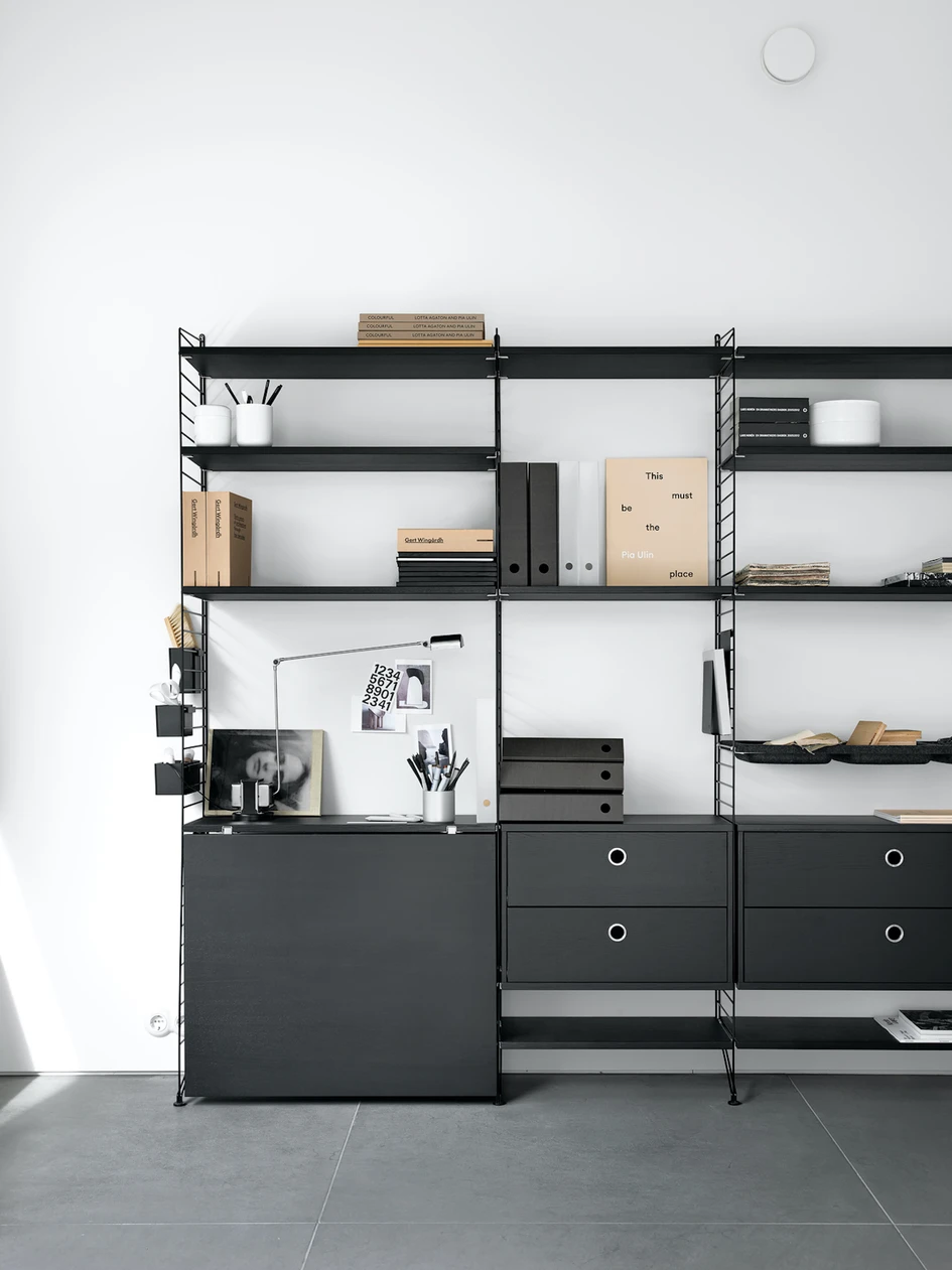 The String Furniture family includes a folding table which blends seamlessly into the background when not in use