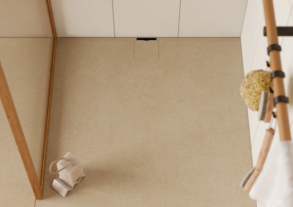 Walls, washbasins or shower floors in uniform cladding allow the various functional areas of a bathroom to formally merge. Here, warm sand tones harmonise with wooden elements