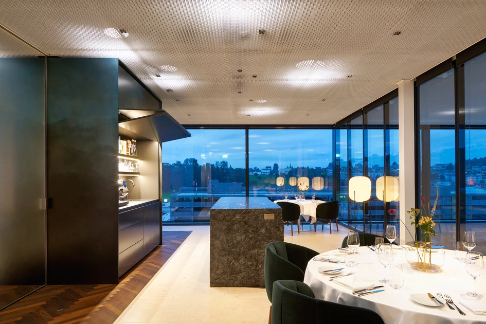 A materially rich, but never excessive, environment, the Schindler Sky Lounge features, among other textural elements, a bar cut from a seven-tonne Alpine boulder