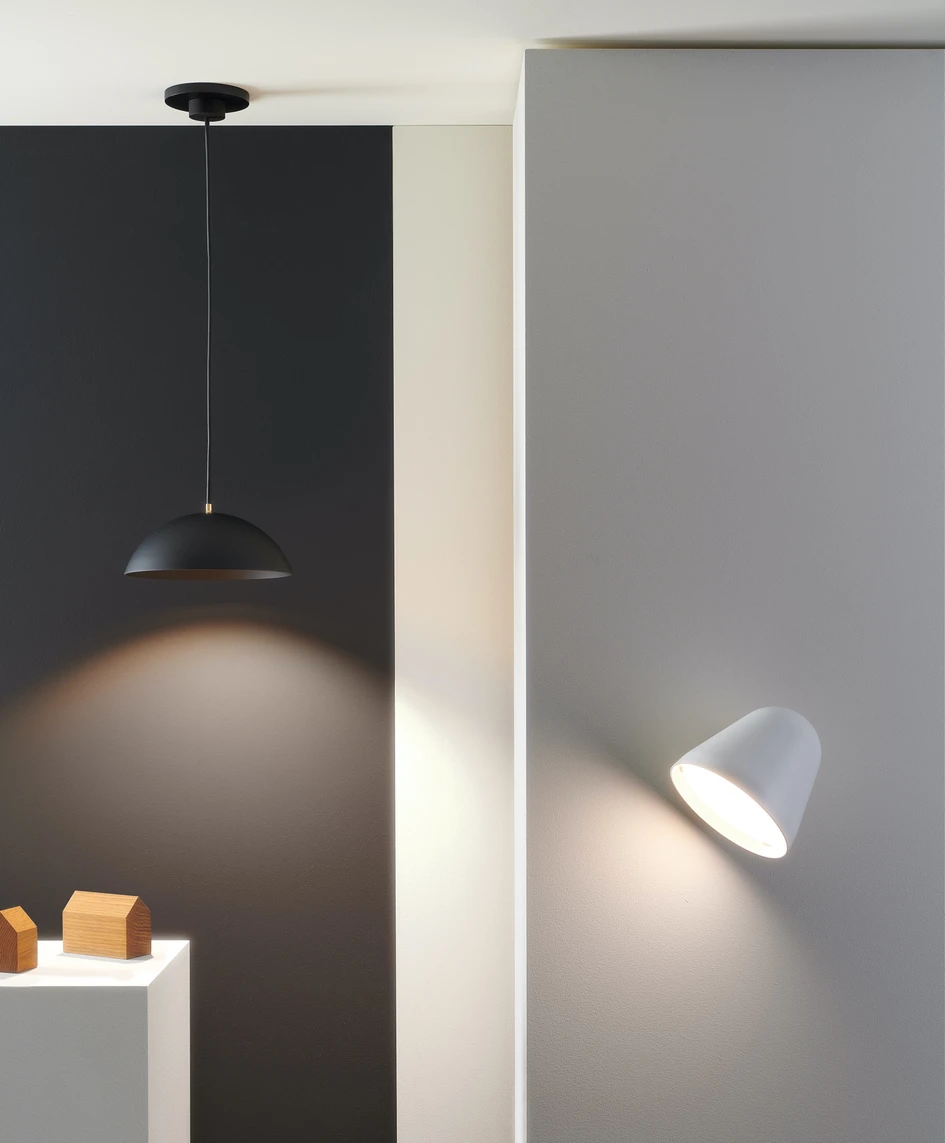 Above: The sculptural Liaison pendant luminaire by Axolight – for Plug & Light. Below: The Pong pendant luminaire and Tilt Wall wall luminaire from young lighting brand Nyta and which work with the Plug & Light system