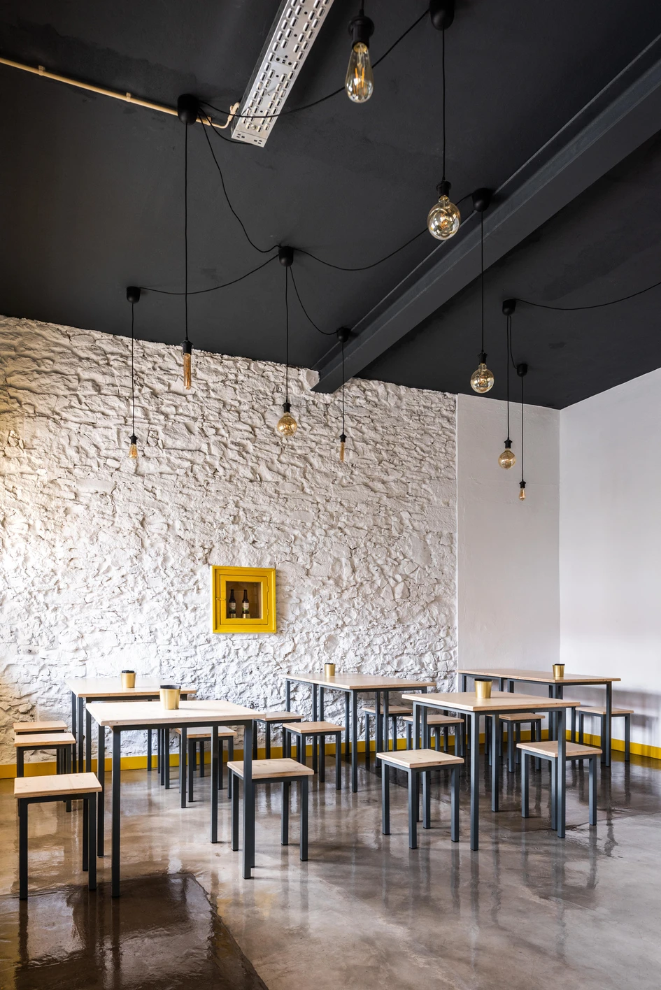 SER-ra's adaptive reuse project of Brewpub in Colares uses modest means to transform a disused space into a bright, welcoming bar. Photos: emontenegro / architectural photography