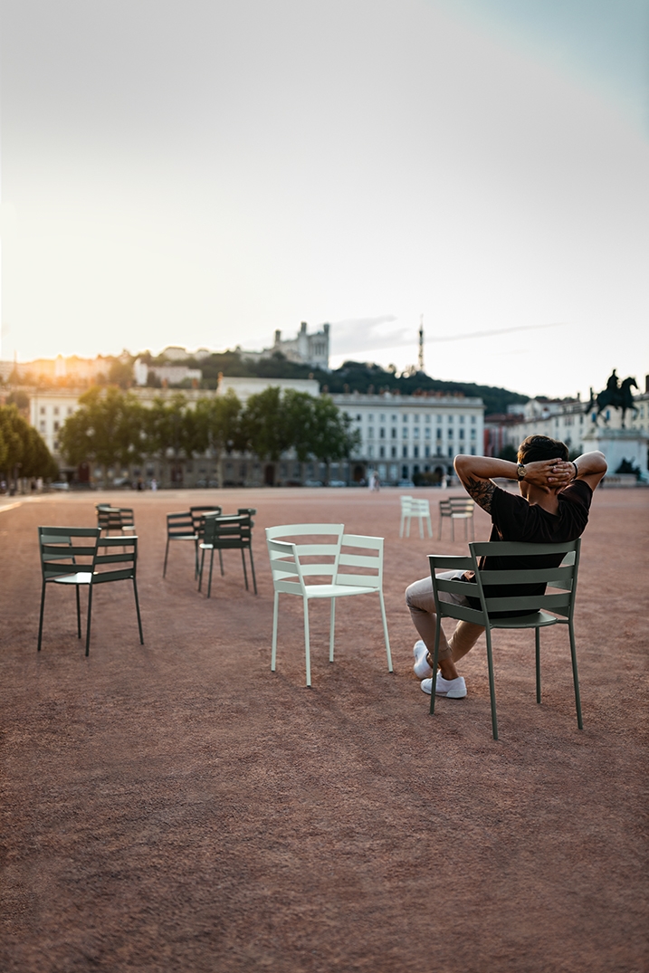 Steel armchairs from the Rhythmic collection, designed by Archirivolto for Fermob, are ideal for relaxed social spaces