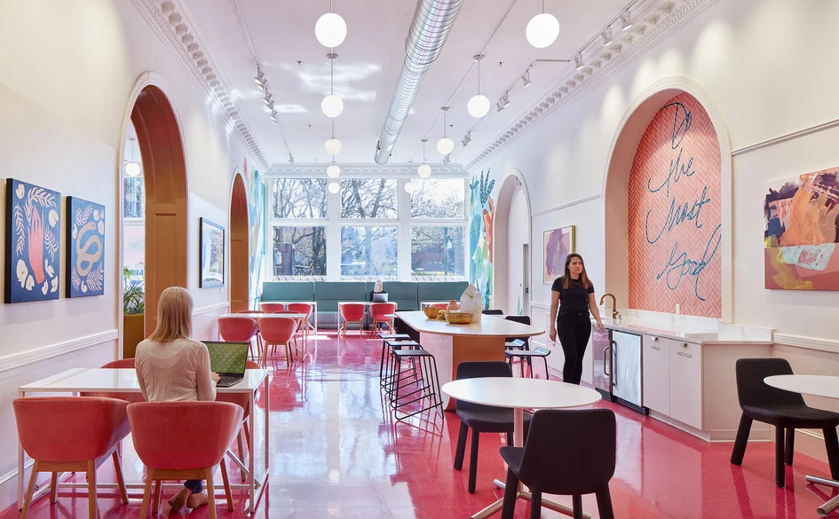 The Coven Co-working space by Studio BV in Saint Paul, Minnesota. The design retains the building's existing Victorian architecture, and introduces boldly coloured furniture. Photo: Corey Gaffer Photography