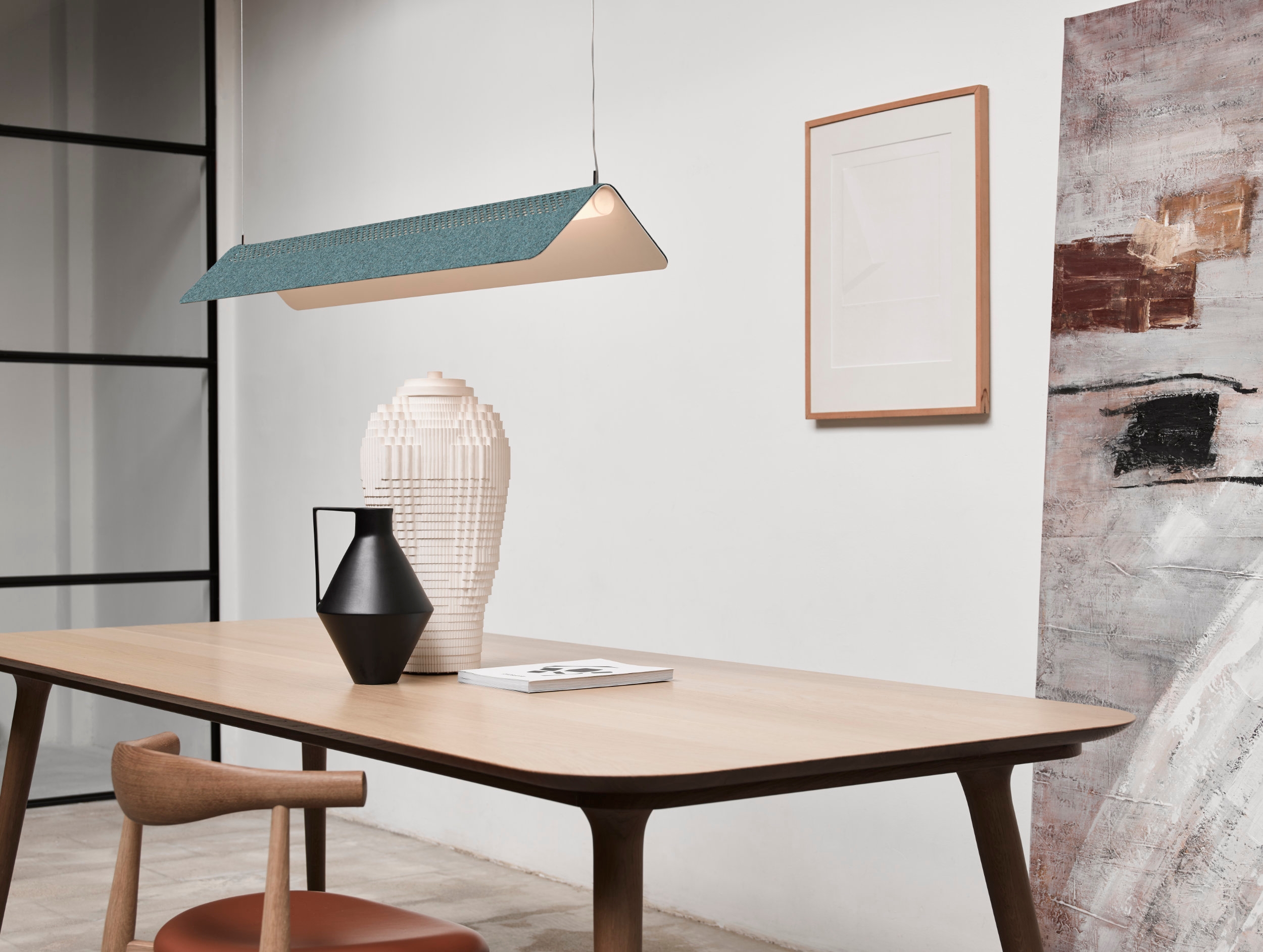 With Flybye’s identically-perforated felt-like Divina MD cover from Kvadrat laid on its back, the suspension or table lamp is given a splash of colour, taking on a fun and playful new personality