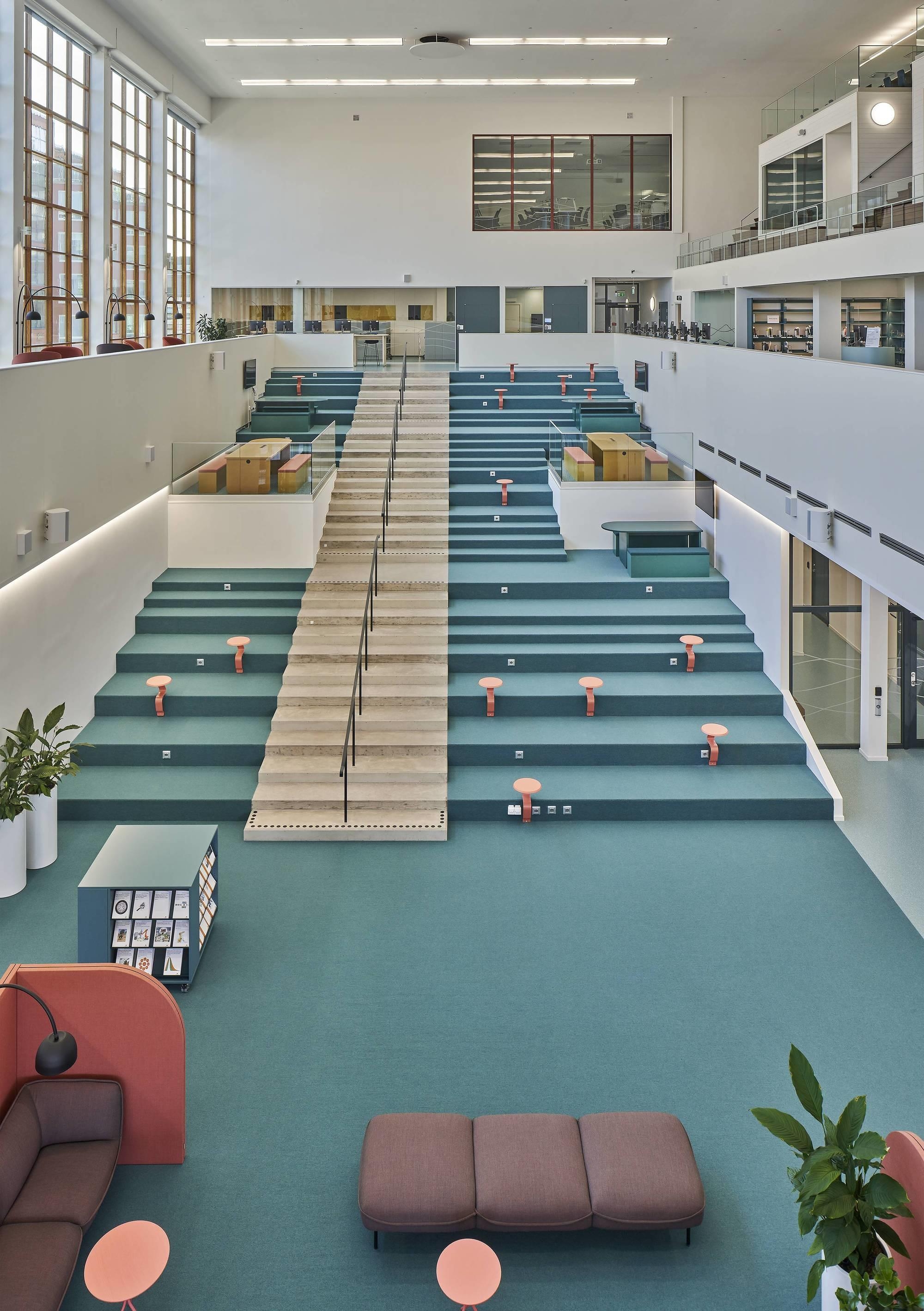 The atrium of the new Mälardalen University Campus Eskilstuna by AIX Arkitekter and 3XN, designed around a former swimming pool from the 1930s. Photo: Åke E:son Lindman
