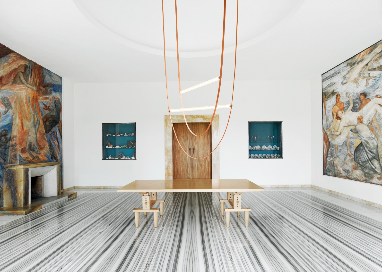 Individually, the rubber cable and ridged glass tube bear something of an industrial aesthetic, but they come together to express something more poetic and sit comfortably in interiors old and new